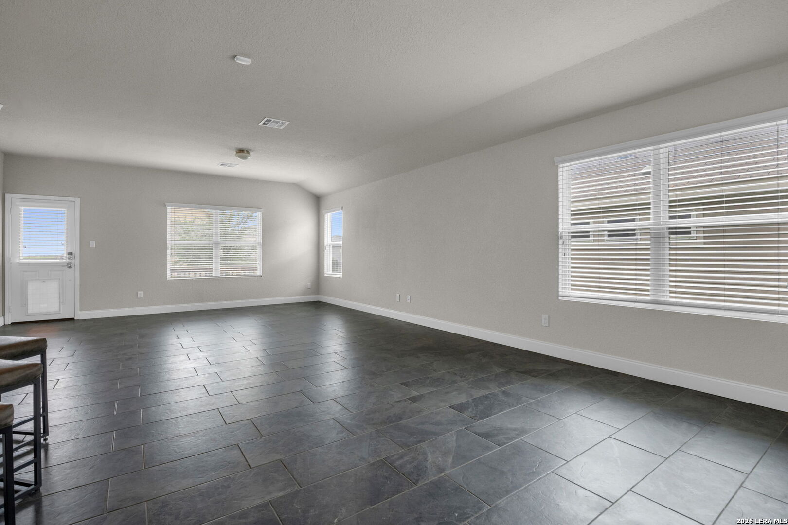 10306 Midsummer Meadow Converse, TX 78109 - Photo 5 of 26 a view of an empty room with a window