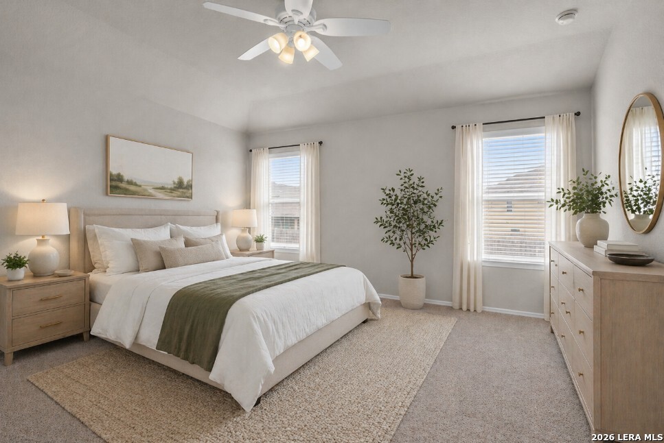 10306 Midsummer Meadow Converse, TX 78109 - Photo 10 of 26 a bedroom with a large bed and a chandelier fan