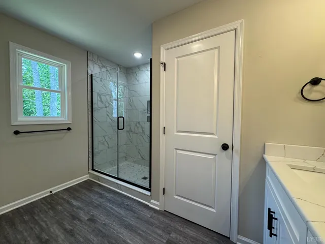 a bathroom with a shower and a sink