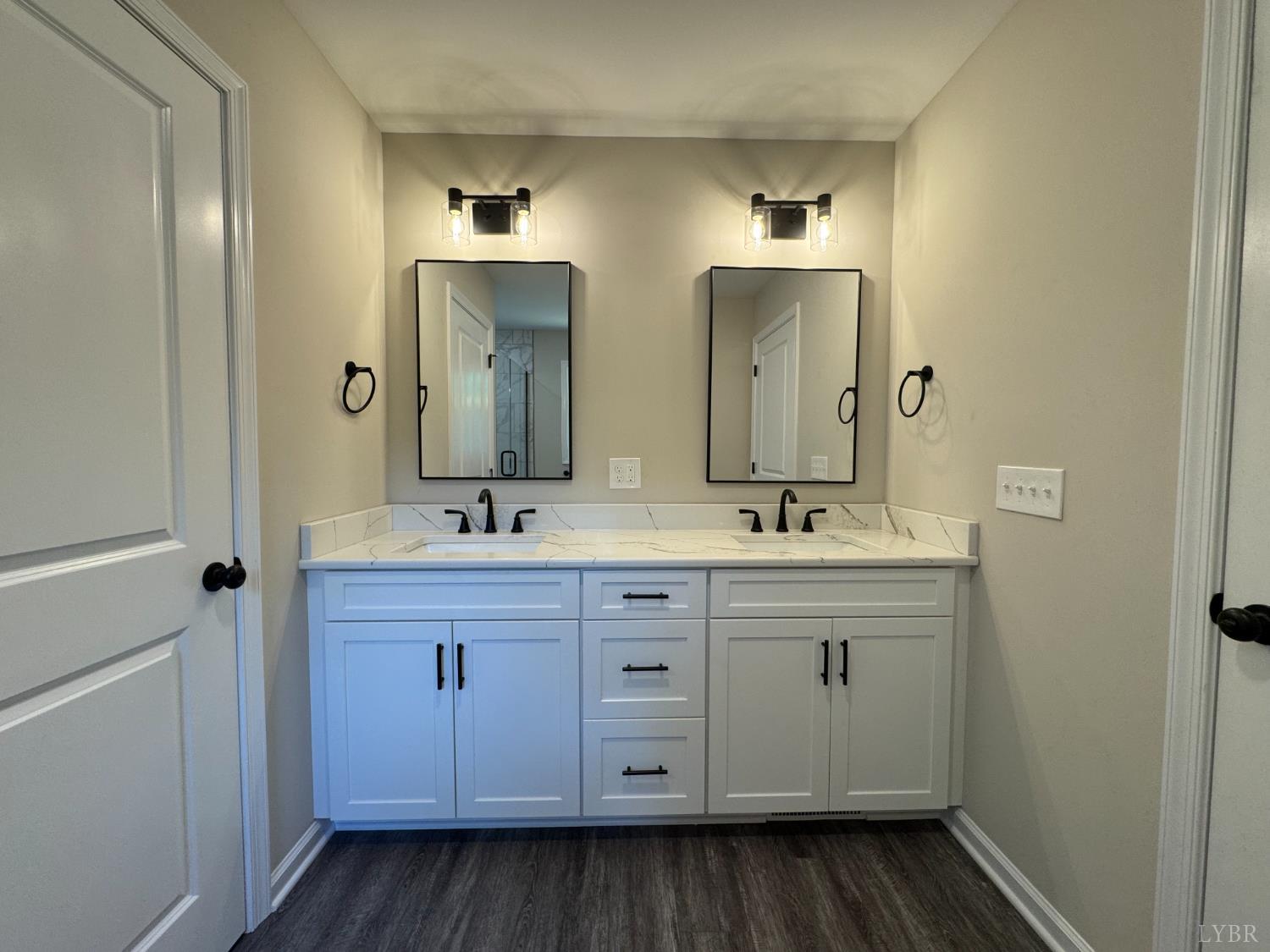 2350 Spg Grv Road Spout Spring, VA 24593 - Photo 14 of 24 a bathroom with a double vanity sink and a mirror