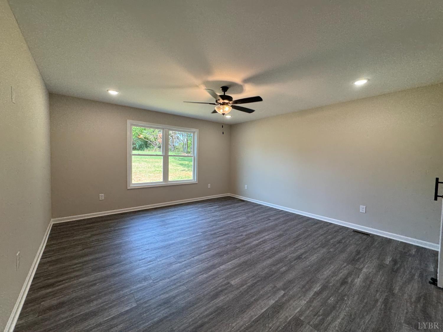 2350 Spg Grv Road Spout Spring, VA 24593 - Photo 8 of 24 wooden floor in an empty room with a window