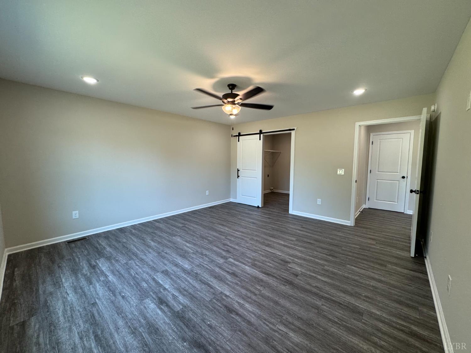 2350 Spg Grv Road Spout Spring, VA 24593 - Photo 9 of 24 a view of an empty room with wooden floor
