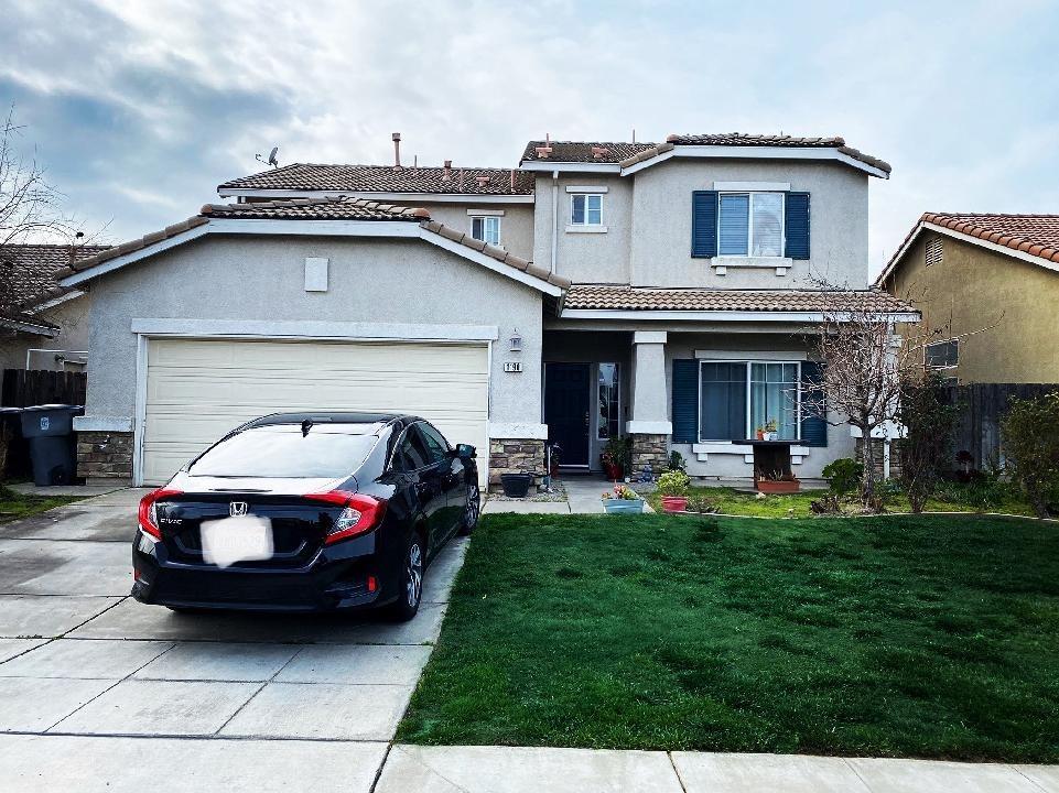 a view of a car in front of house