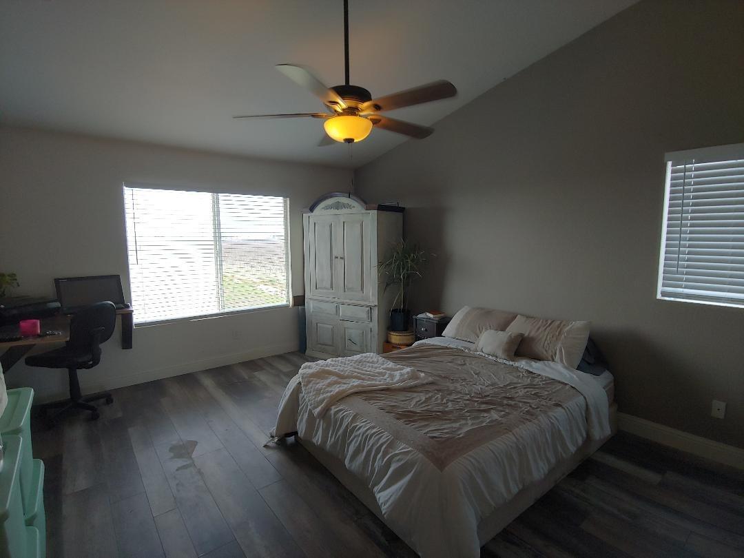1190 Hazelnut Lane Madera, CA 93637 - Photo 11 of 18 a bedroom with a bed and wooden floor