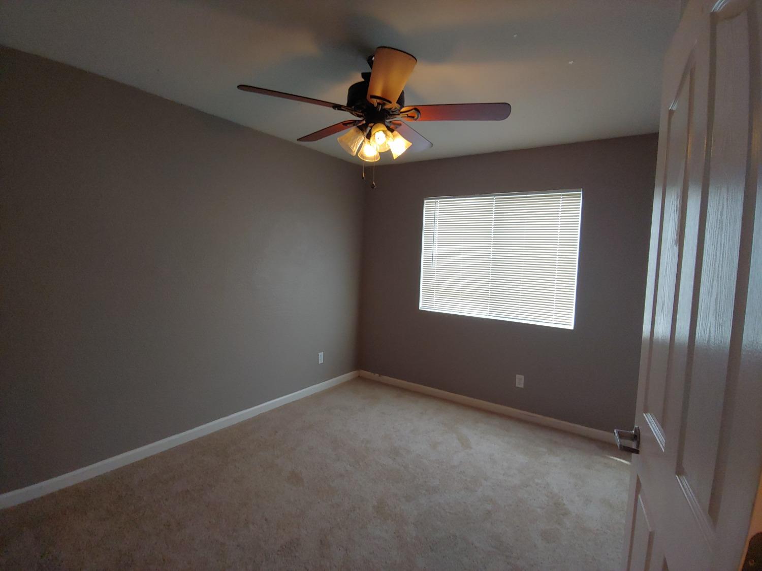 1190 Hazelnut Lane Madera, CA 93637 - Photo 17 of 18 a view of an empty room with a window