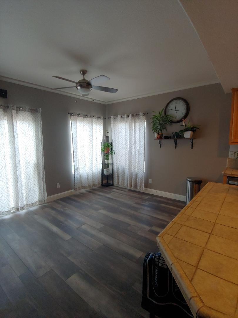 1190 Hazelnut Lane Madera, CA 93637 - Photo 5 of 18 a view of a room with window and wooden floor