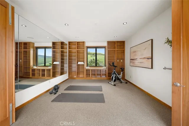 a view of a lush green hillside and some houses