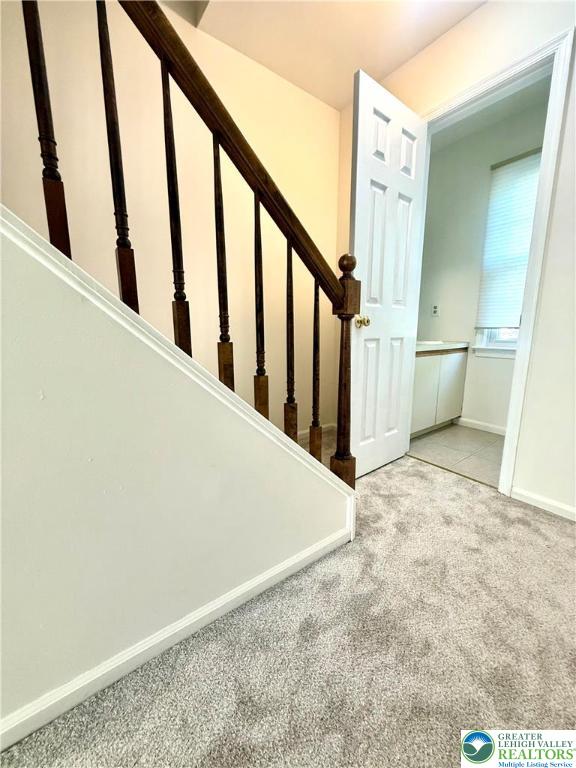1045 Barnside Road Allentown, PA 18103 - Photo 17 of 29 a view of staircase with railing and white walls