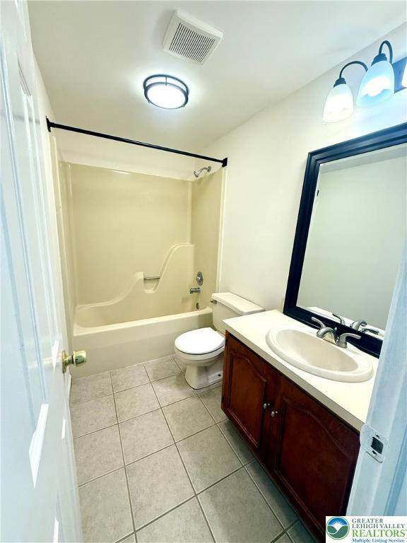 1045 Barnside Road Allentown, PA 18103 - Photo 20 of 29 a bathroom with a double vanity sink toilet mirror and shower