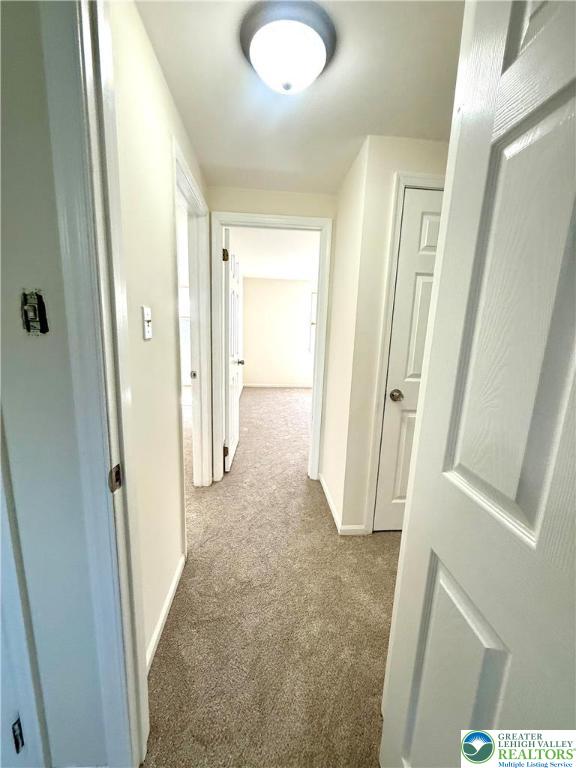 1045 Barnside Road Allentown, PA 18103 - Photo 25 of 29 a view of a hallway with wooden floor and cabinets
