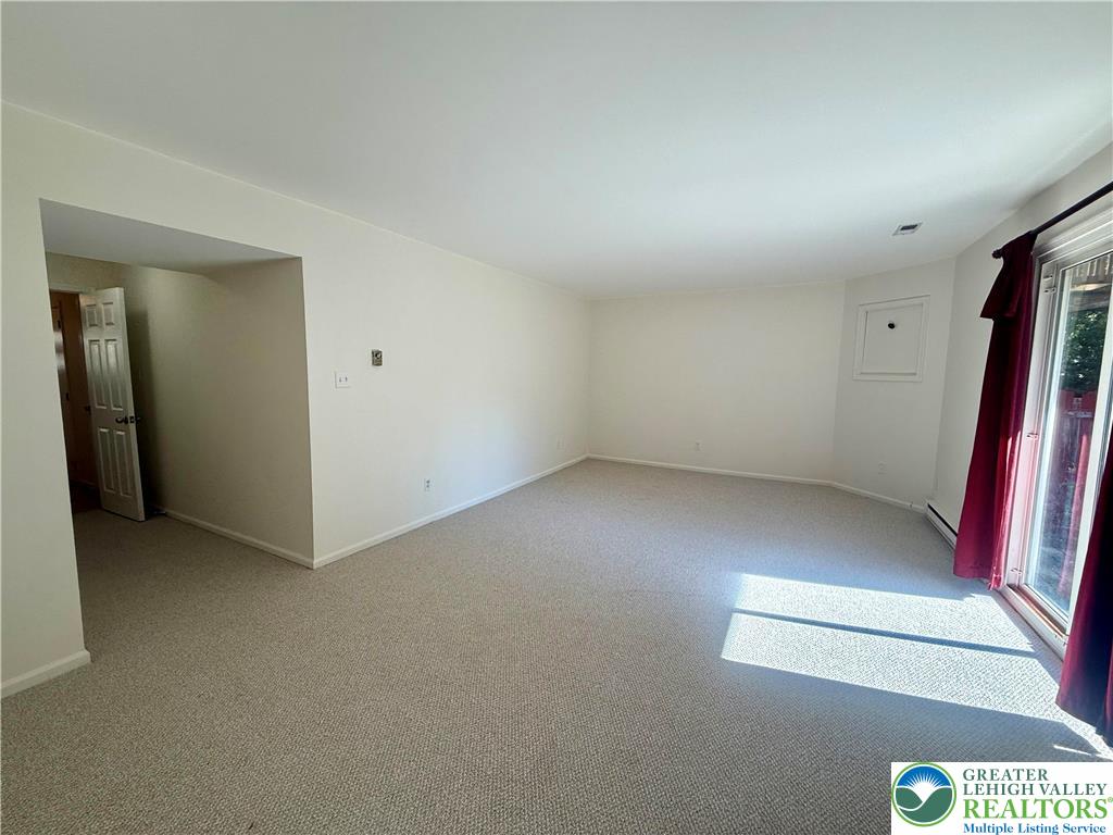 1045 Barnside Road Allentown, PA 18103 - Photo 5 of 29 an empty room with a projector and closet