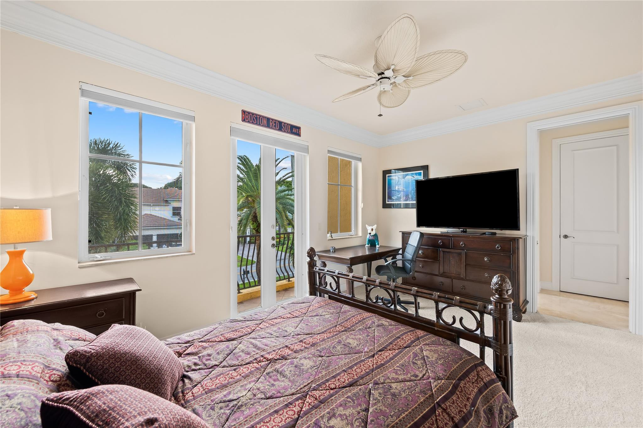 2637 Northeast 28th Court Lighthouse Point, FL 33064 - Photo 15 of 50 a bedroom with a bed and a flat screen tv