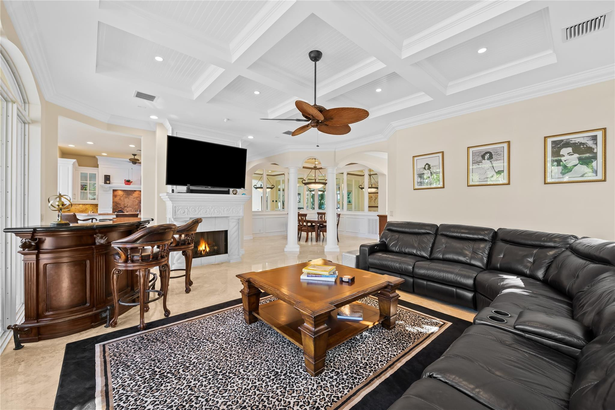 2637 Northeast 28th Court Lighthouse Point, FL 33064 - Photo 24 of 50 a living room with furniture a flat screen tv and kitchen view