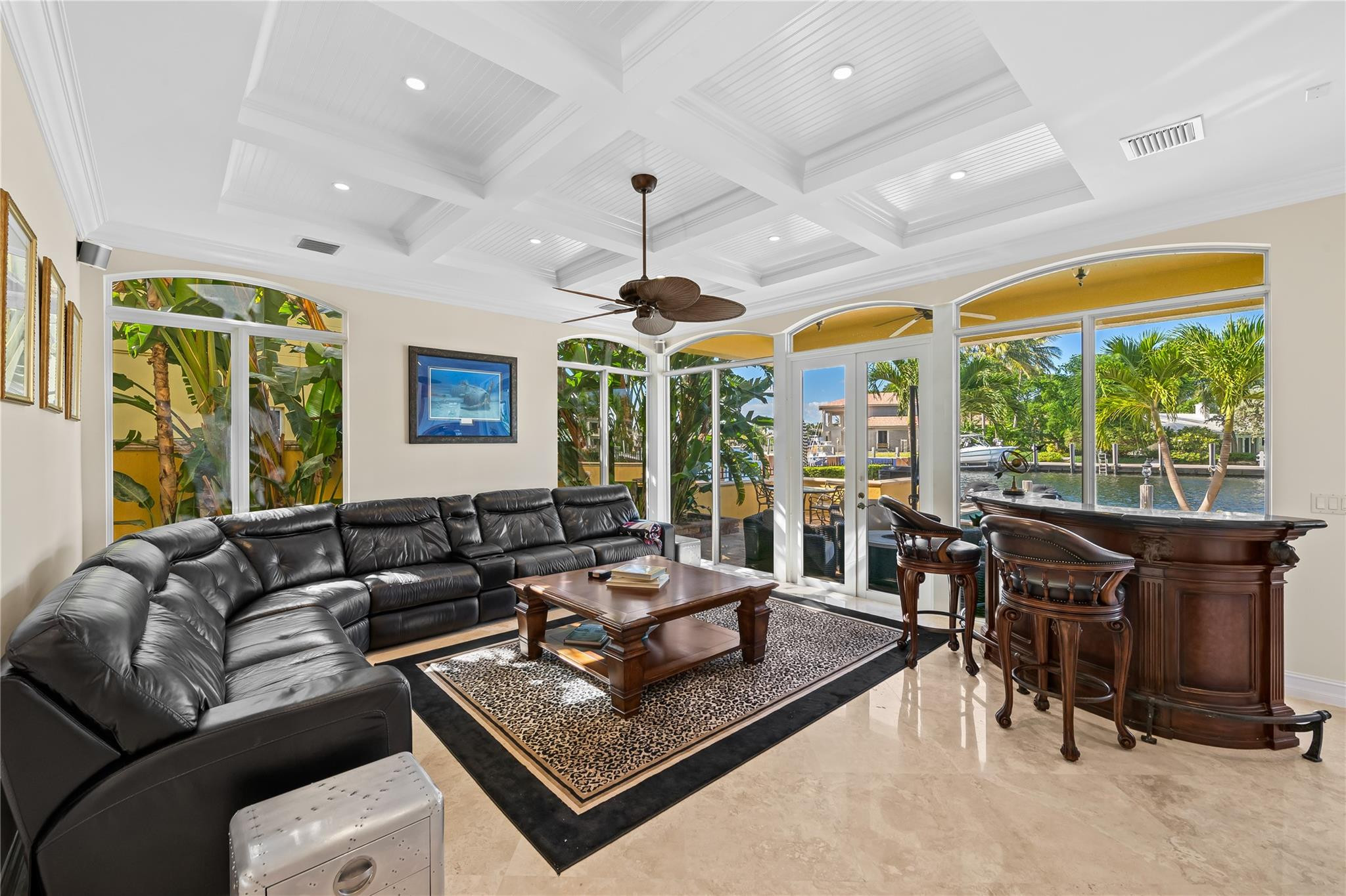 2637 Northeast 28th Court Lighthouse Point, FL 33064 - Photo 25 of 50 a living room with furniture ceiling fan and a large window