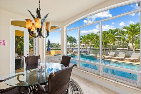 a kitchen with granite countertop cabinets stainless steel appliances and a counter space