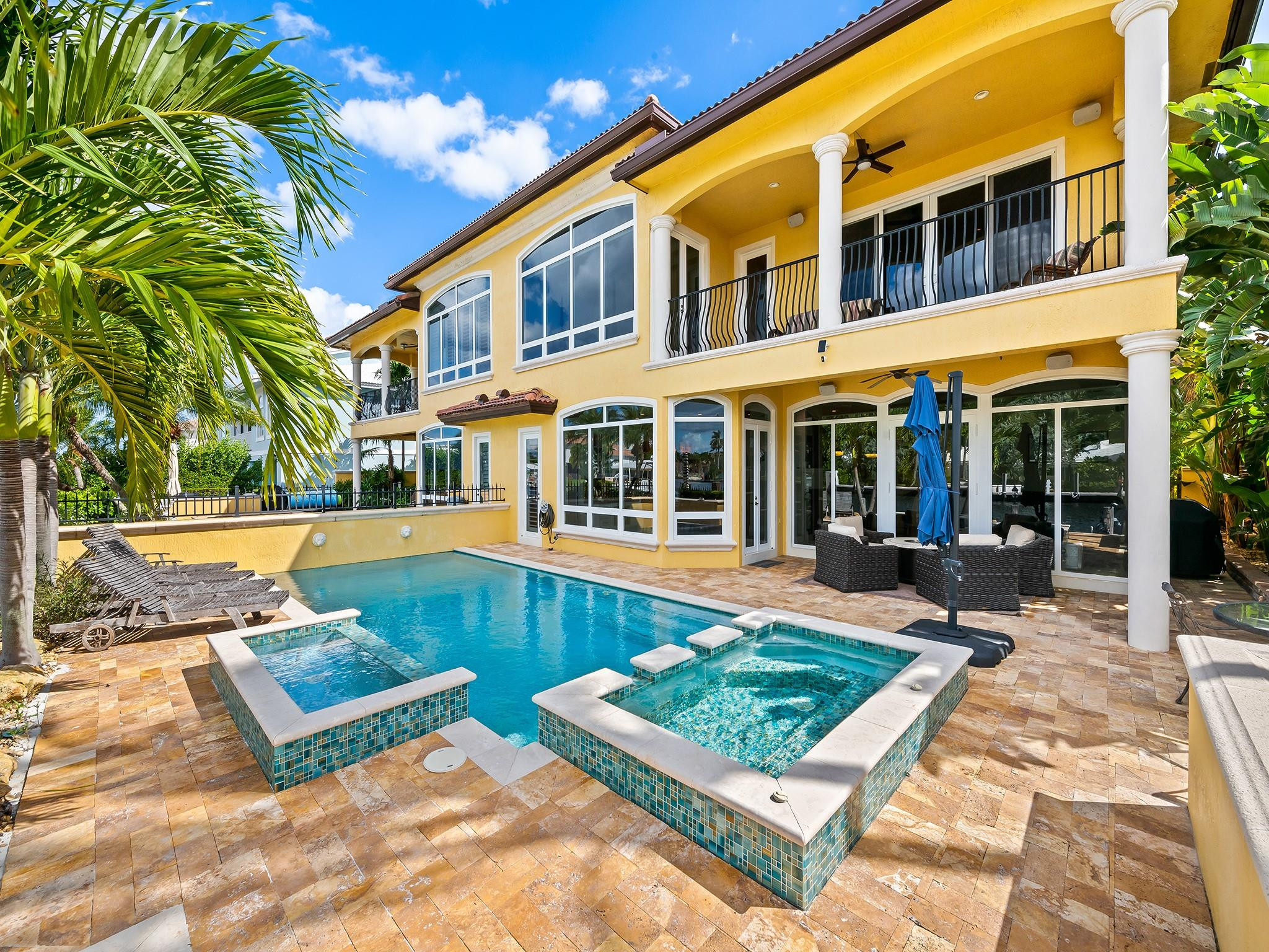 2637 Northeast 28th Court Lighthouse Point, FL 33064 - Photo 3 of 50 a view of a house with pool and sitting area