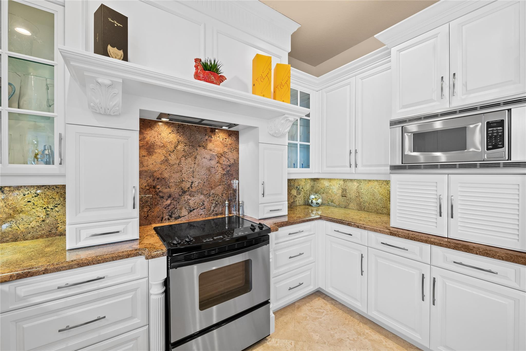2637 Northeast 28th Court Lighthouse Point, FL 33064 - Photo 31 of 50 a kitchen with granite countertop cabinets stainless steel appliances and a counter space