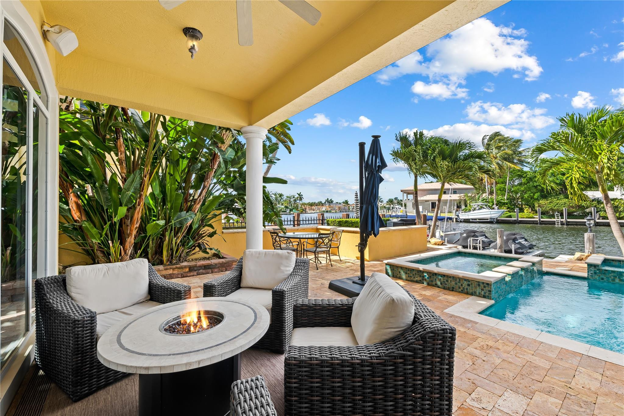 2637 Northeast 28th Court Lighthouse Point, FL 33064 - Photo 4 of 50 a outdoor space with patio furniture and a potted plant