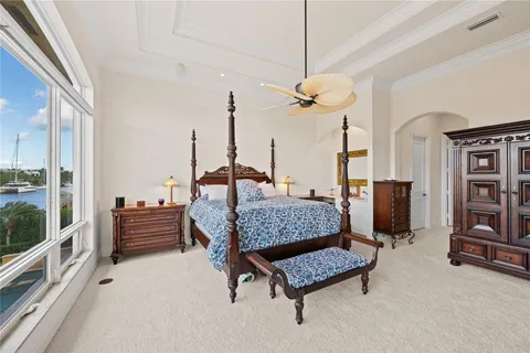 a spacious bathroom with a toilet a sink and mirror