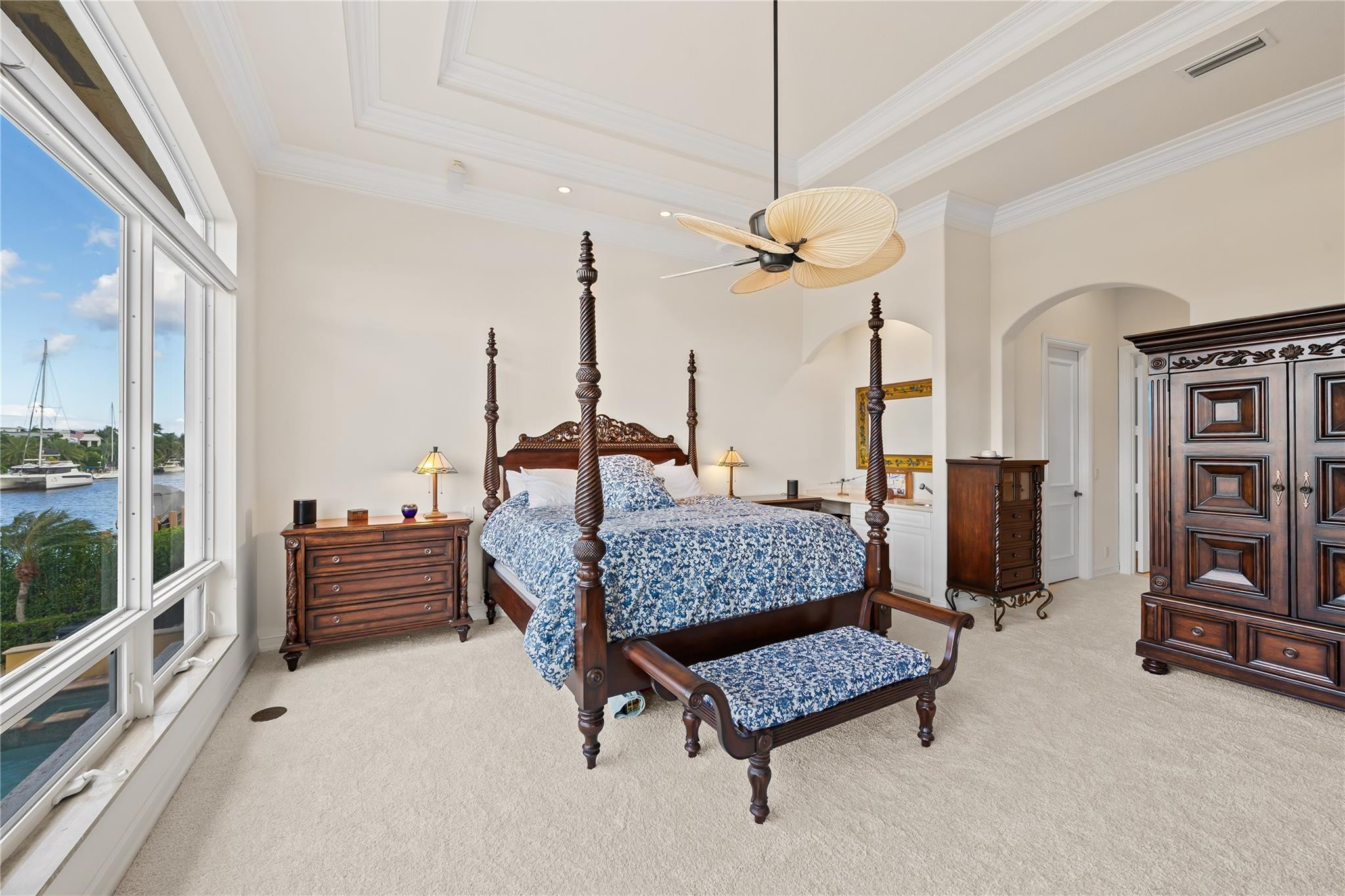 2637 Northeast 28th Court Lighthouse Point, FL 33064 - Photo 8 of 50 a bedroom with furniture and a chandelier