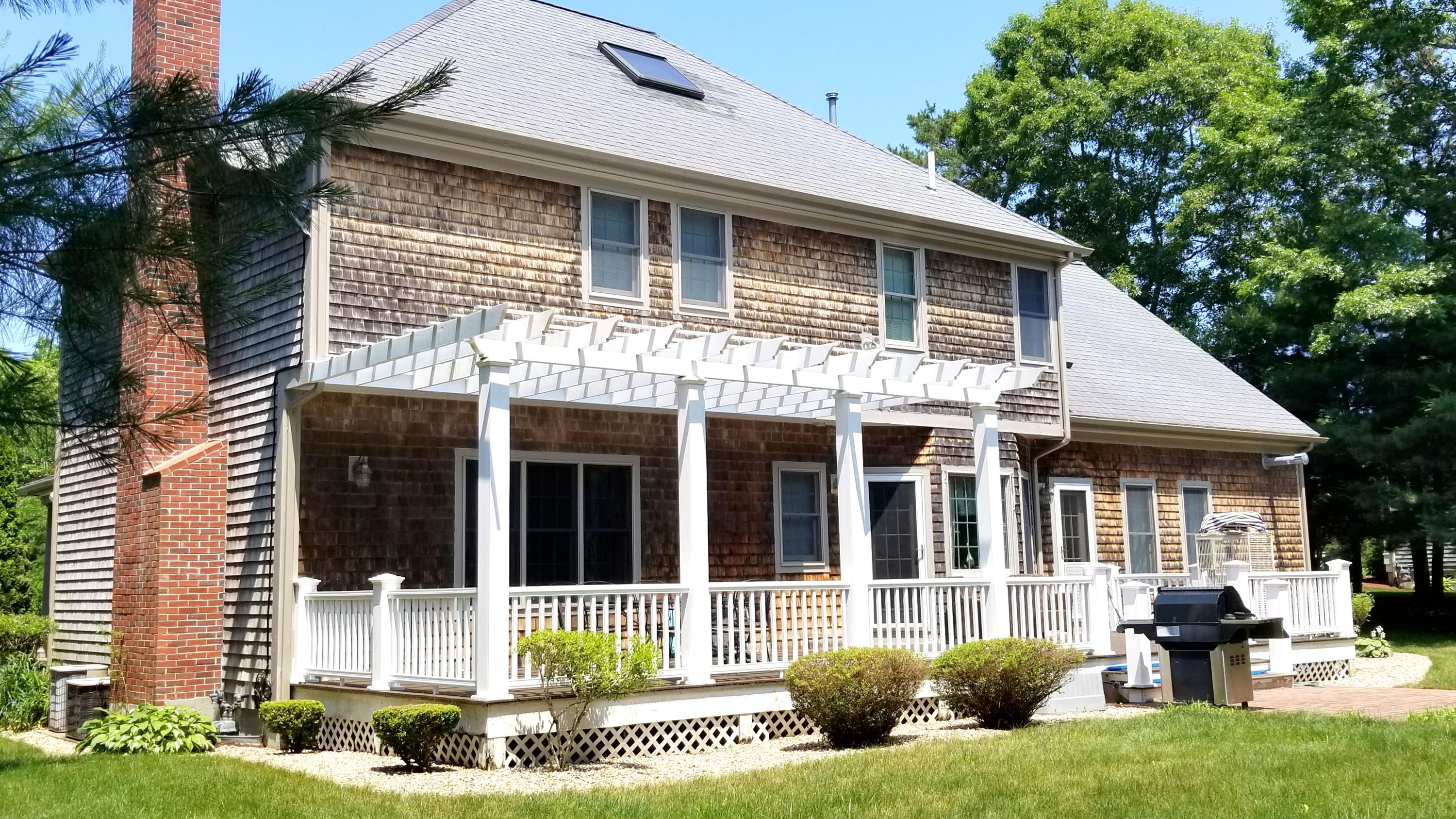 7 Penelope Road Monument Beach, MA 02532 - Photo 2 of 31 a view of a house with a yard and sitting area