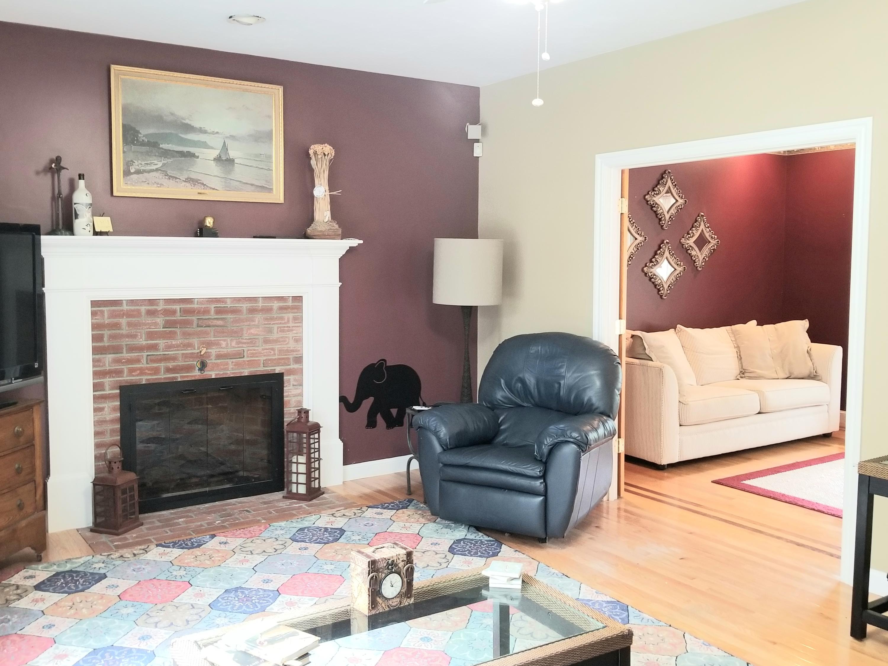 7 Penelope Road Monument Beach, MA 02532 - Photo 4 of 31 a living room with furniture and a fireplace