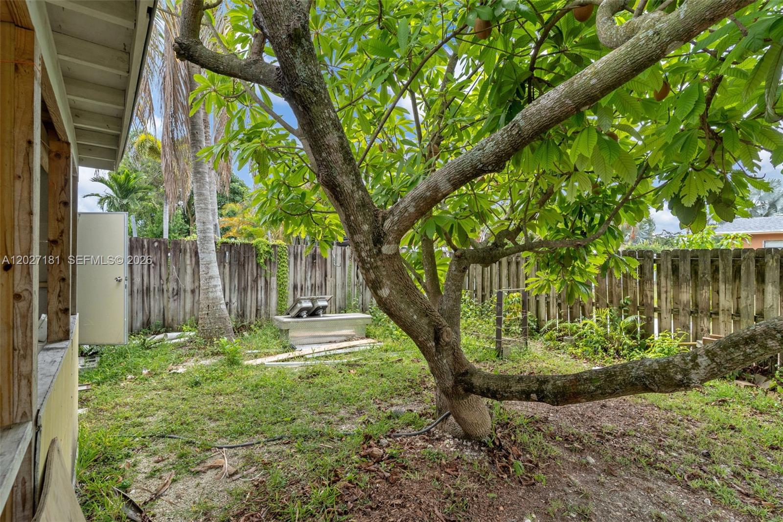 15440 Southwest 294th Terrace Homestead, FL 33033 - Photo 28 of 31 a backyard of a house with lots of green space