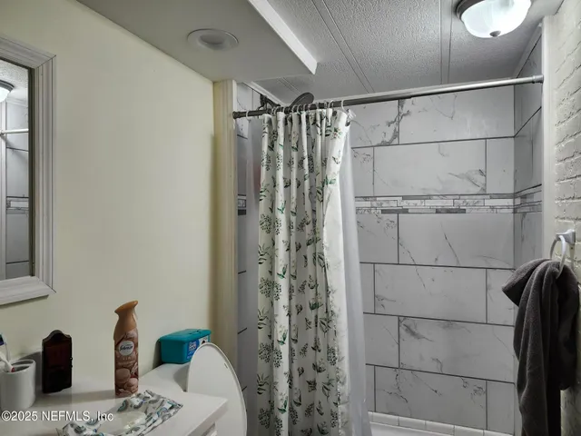 a bedroom with bed and window