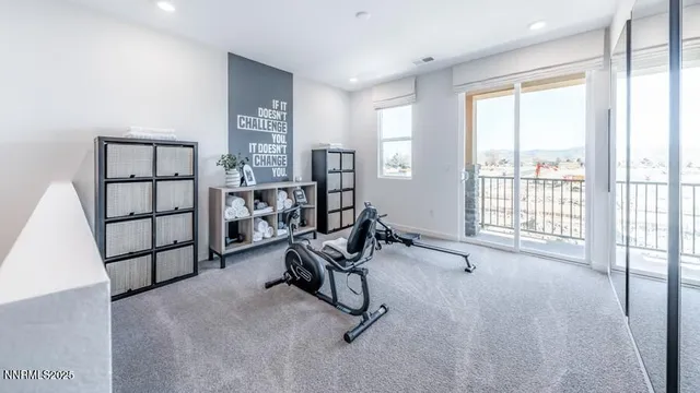 a view of a livingroom with furniture and windows