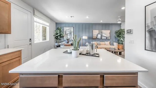 a large white kitchen with a large window