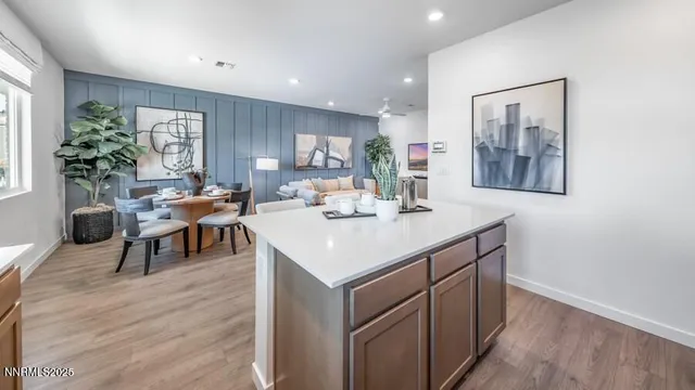 a kitchen with a sink cabinets and wooden floor