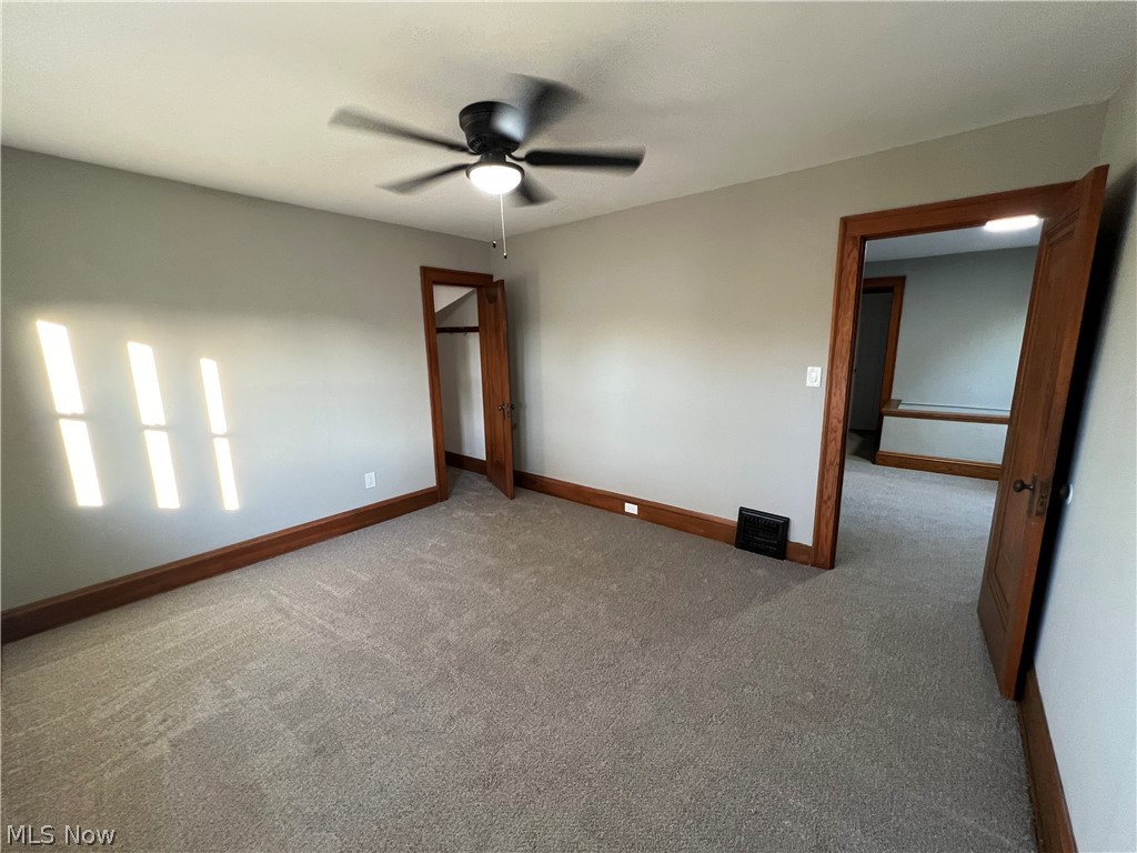 4523 Maplecrest Avenue Parma, OH 44134 - Photo 21 of 31 Empty room with ceiling fan and carpet flooring