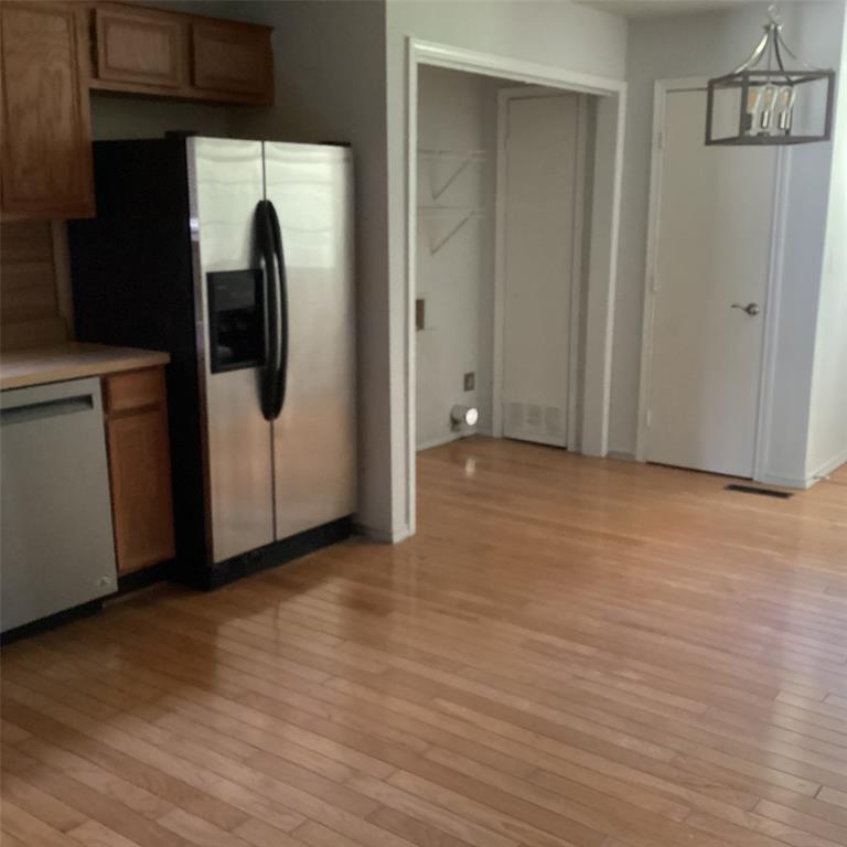 1506 South Travis Street Denison, TX 75021 - Photo 19 of 22 Wood flooring in kitchen.