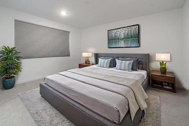 a bedroom with bed and window