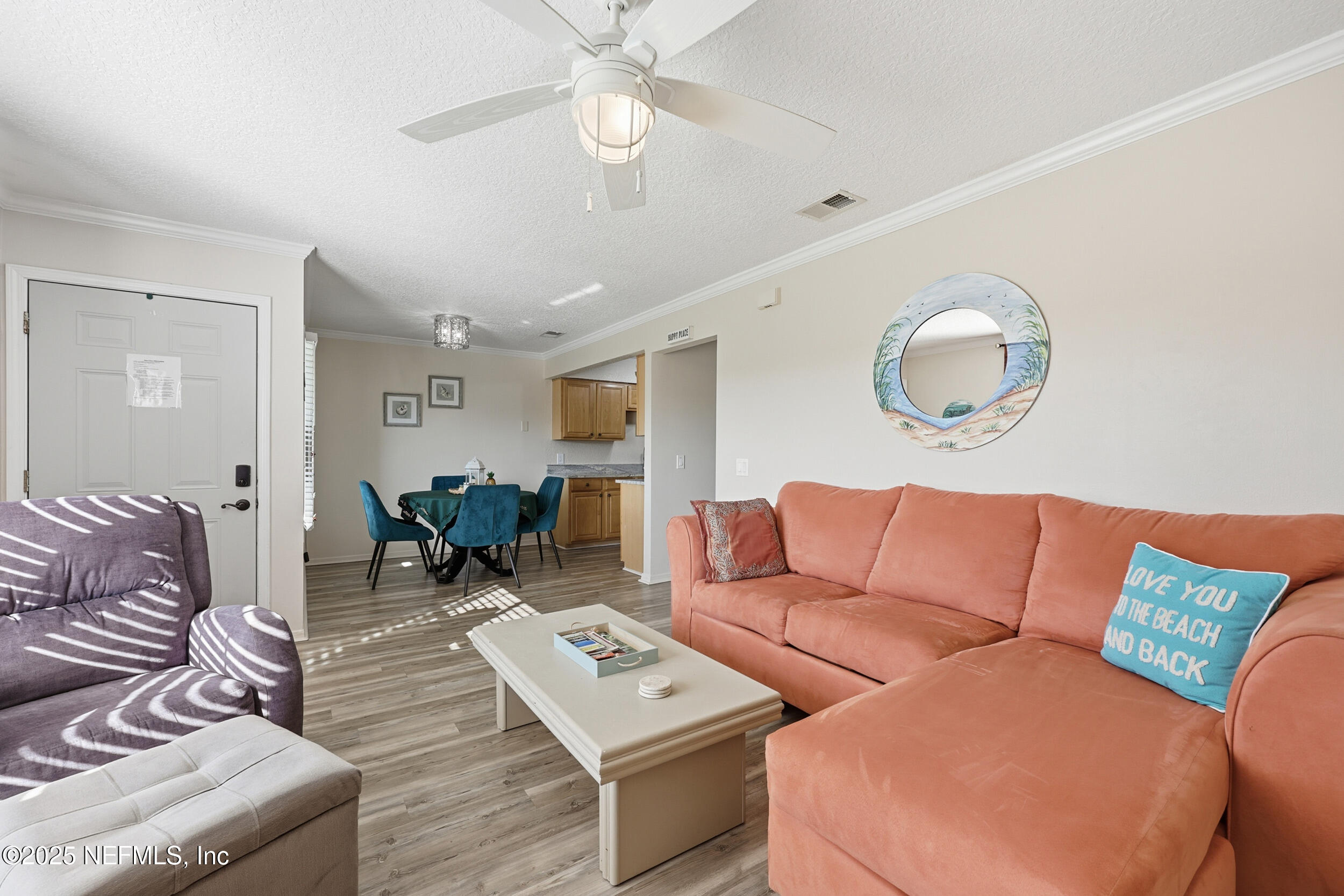 47 Clipper Court St. Augustine, FL 32080 - Photo 11 of 50 a living room with furniture a rug and a large window