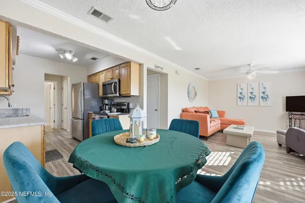 a kitchen with stainless steel appliances granite countertop a sink and a stove