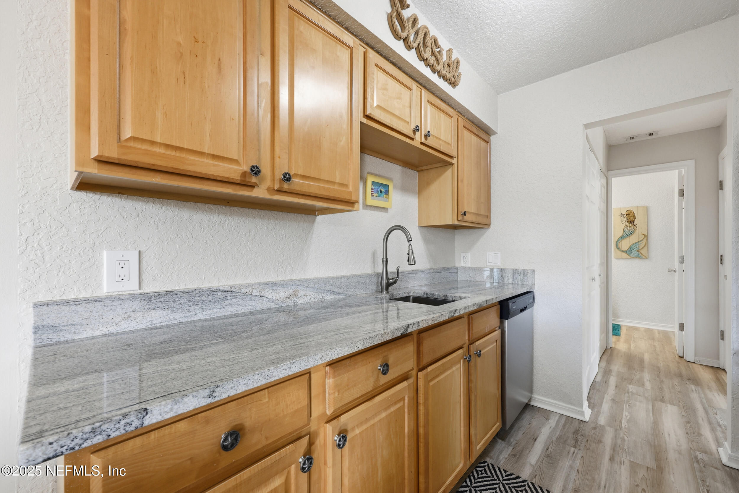 47 Clipper Court St. Augustine, FL 32080 - Photo 17 of 50 a kitchen with granite countertop a sink and cabinets
