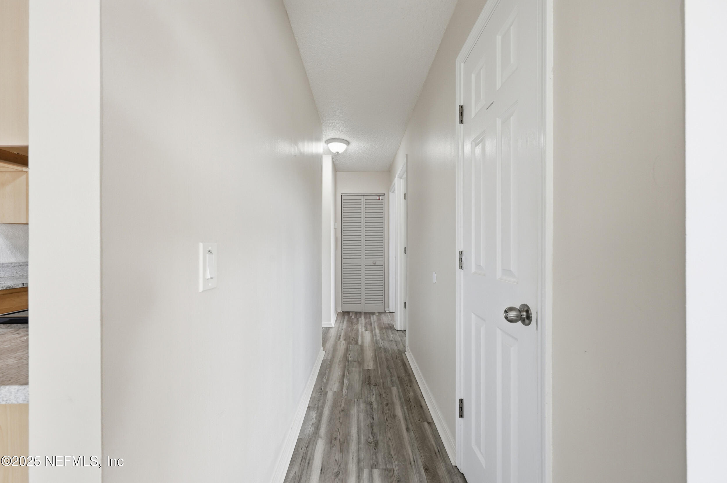47 Clipper Court St. Augustine, FL 32080 - Photo 19 of 50 a view of a hallway with wooden floor
