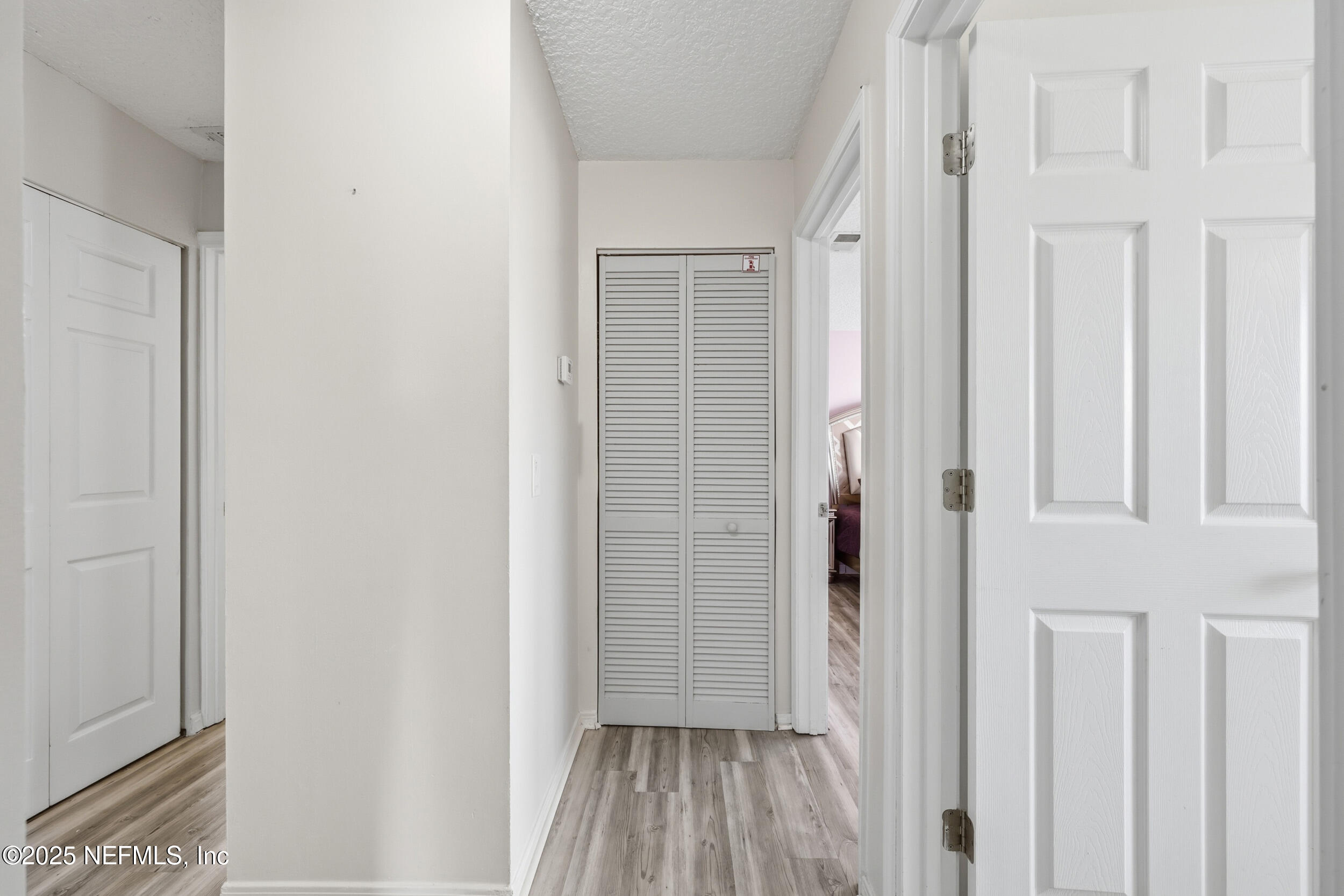 47 Clipper Court St. Augustine, FL 32080 - Photo 20 of 50 a view of a hallway with wooden floor and closet area