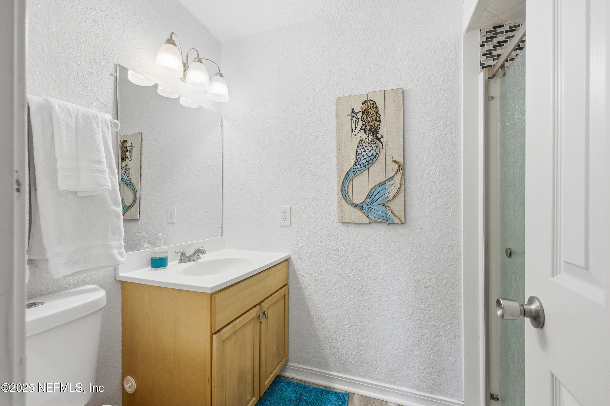 47 Clipper Court St. Augustine, FL 32080 - Photo 27 of 50 a bathroom with a sink a toilet and shower