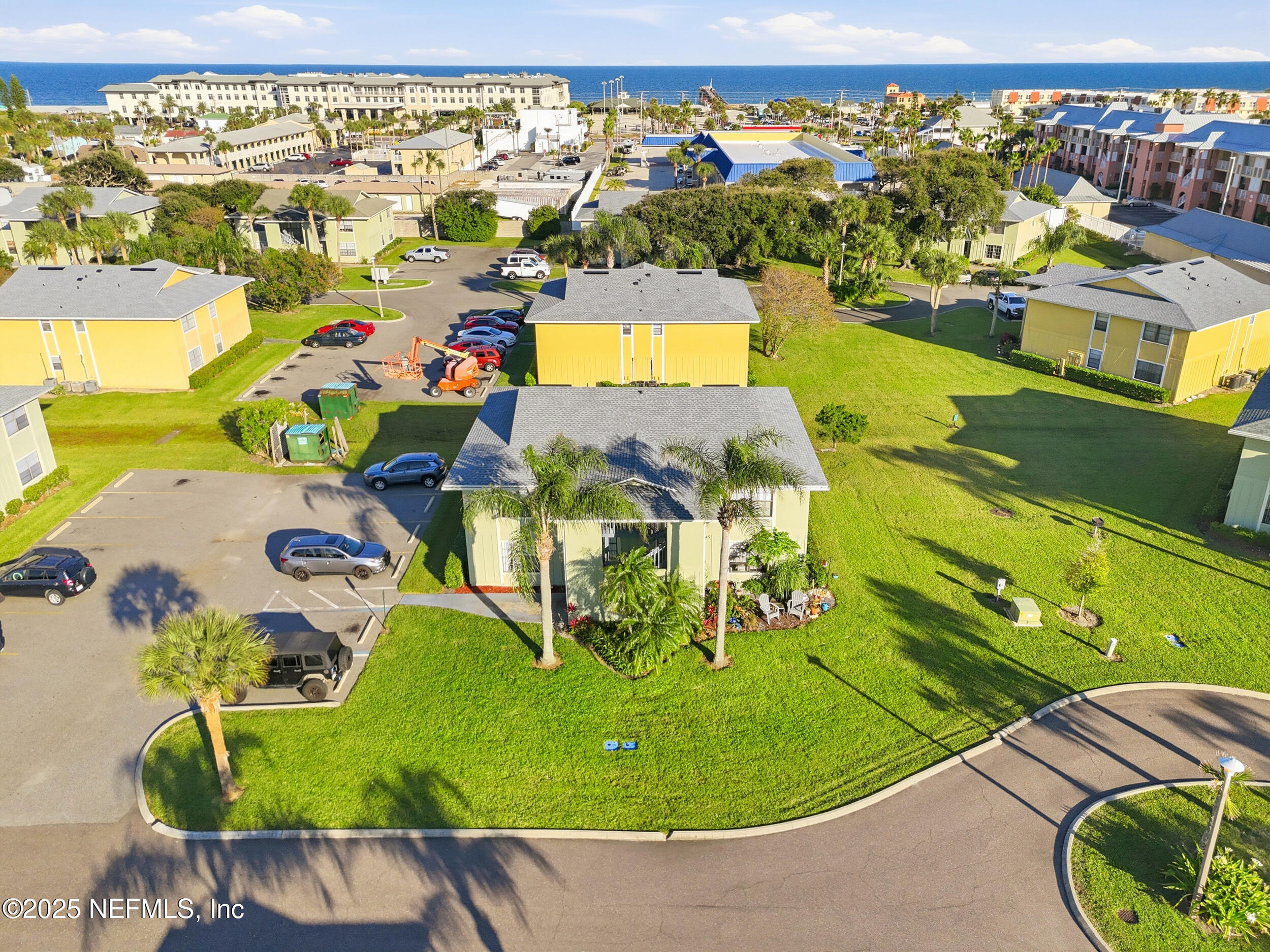 47 Clipper Court St. Augustine, FL 32080 - Photo 31 of 50 an aerial view of a swimming pool with a yard and outdoor seating
