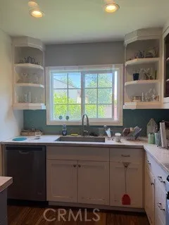 a kitchen with a sink and cabinets