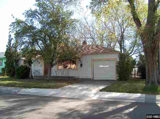 978 Lester Avenue Reno, NV 89502 - Photo 1 of 7 a front view of a house with a yard
