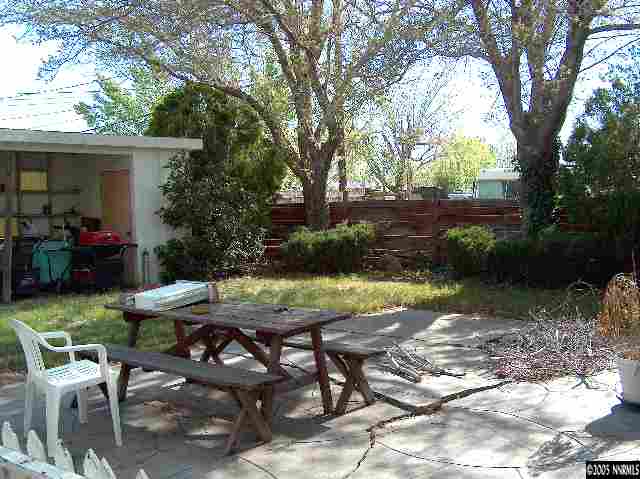 978 Lester Avenue Reno, NV 89502 - Photo 6 of 7 a view of backyard with seating space and trees