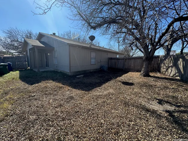 a view of a backyard of the house