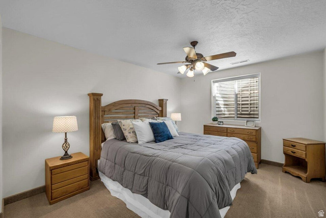 841 1010 S Street St. George, UT 84790 - Photo 22 of 33 Bedroom featuring carpet, ceiling fan, and a textured ceiling