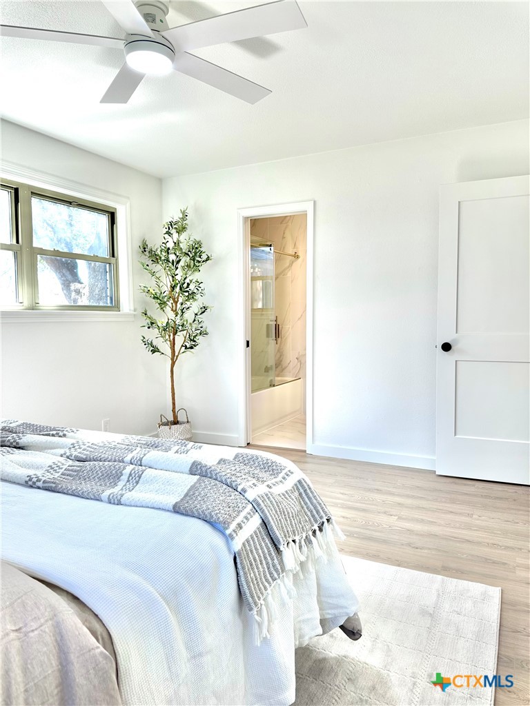 4412 Briar Cliff Road Temple, TX 76502 - Photo 18 of 28 a bedroom with a bed and a window