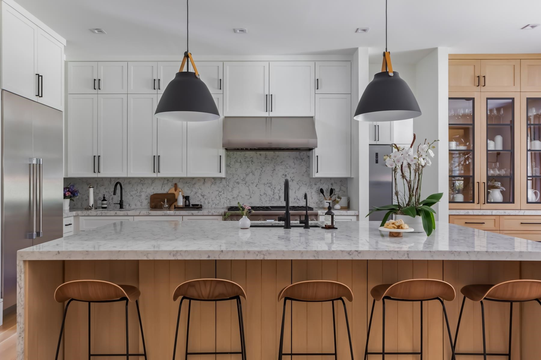 4003 Bristol Road Durham, NC 27707 - Photo 17 of 100 a kitchen with granite countertop a table chairs stove and cabinets