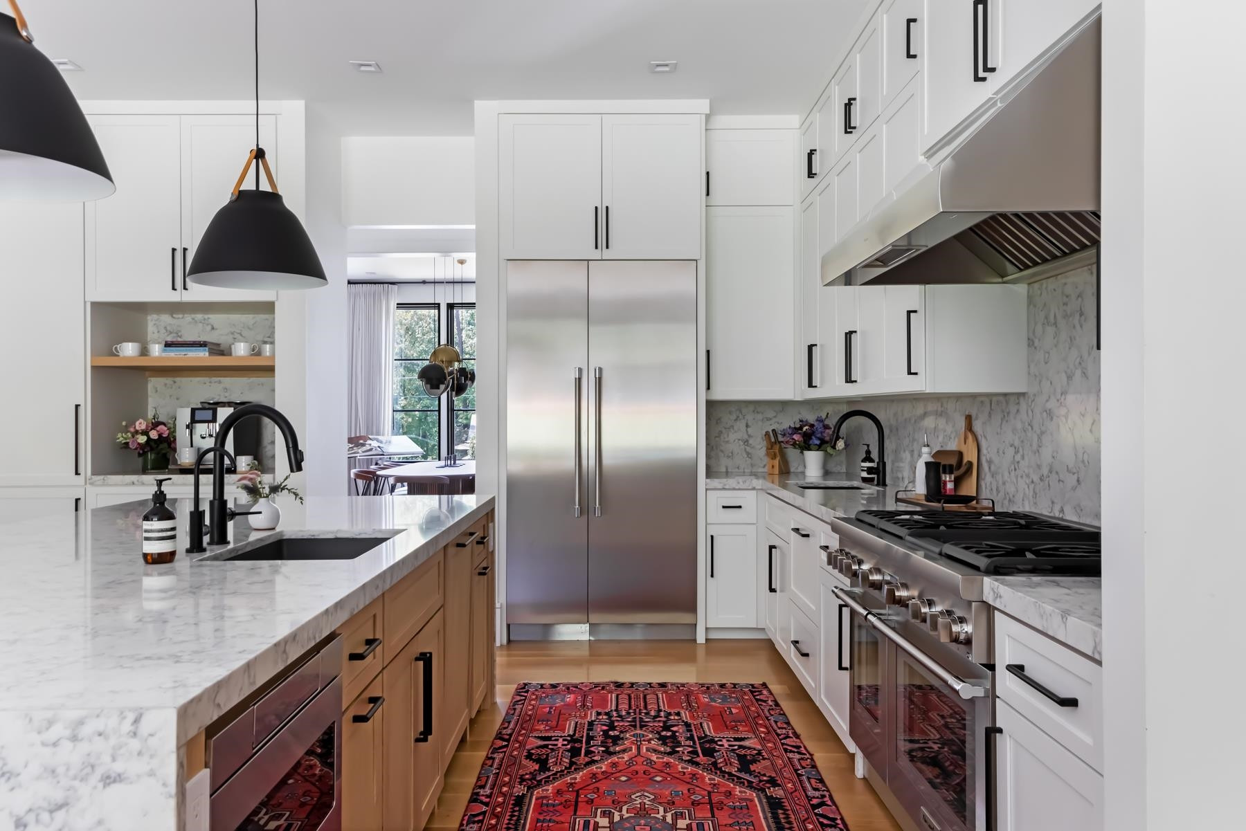 4003 Bristol Road Durham, NC 27707 - Photo 20 of 100 a kitchen with granite countertop a sink stainless steel appliances and cabinets