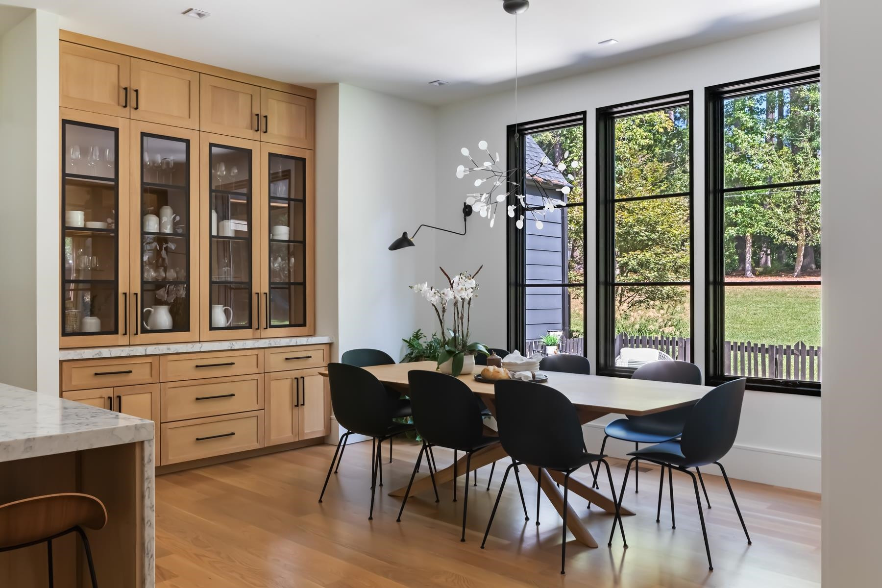 4003 Bristol Road Durham, NC 27707 - Photo 22 of 100 a view of a dining room with furniture large windows and wooden floor